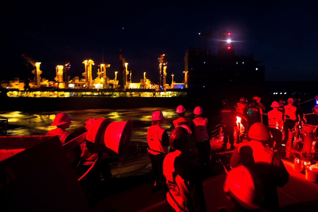 Sailors assigned to the guided-missile destroyer USS McCampbell observe a replenishment with the Military Sealift Command fleet replenishment oiler USNS Walter S. Diehl during Valiant Shield 2016 in the Philippine Sea, Sept. 16, 2016. The biennial exercise focuses on integrating joint training among U.S. forces. Navy photo by Petty Officer 2nd Class Christian Senyk