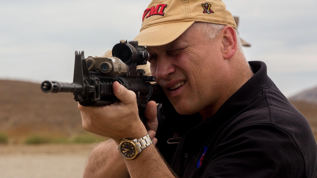 Retired Marine Col. Christopher Starling, now the vice president and chief development officer of the Marines’ Memorial Association, sights in with an M4A1 carbine during a range safety brief aboard Marine Corps Base Camp Pendleton, Calif., Sept. 19, 2016. During their visit, members interacted with Marines to gain an understanding of the advancements in training and equipment the Marine Corps has  recently made. 