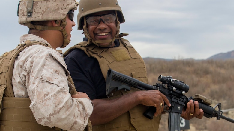 Retired Marine Maj. Gen. Anthony Jackson, now a board member with the Marines’ Memorial Association, laughs with a range safety officer after shooting an M4A1 carbine aboard Marine Corps Base Camp Pendleton, Calif., Sept. 19, 2016. Members of the MMA interacted with active duty Marines to reconnect and familiarize themselves with the 1st Marine Division and Camp Pendleton. 