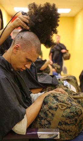 A recruit of Kilo Company, 3rd Recruit Training Battalion, receives his initial haircut at Marine Corps Recruit Depot San Diego, Sept. 19. Recruits receive haircuts immediately after arriving to create uniformity. Annually, more than 17,000 males recruited from the Western Recruiting Region are trained at MCRD San Diego. Kilo Company is scheduled to graduate Dec. 16.