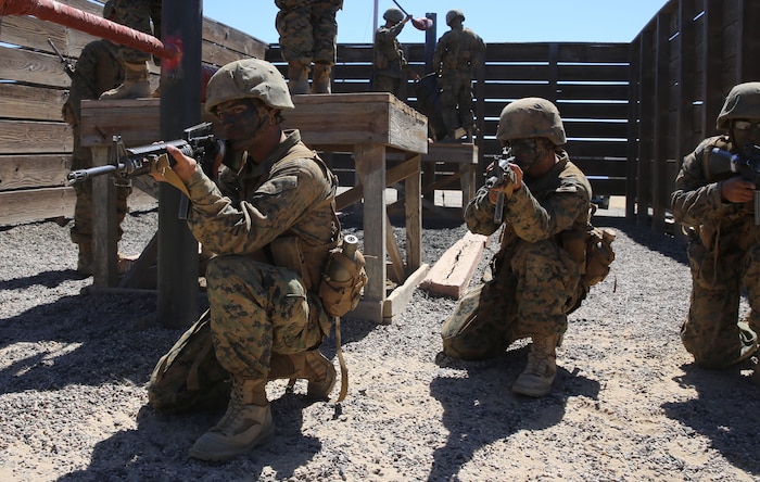 Private First Class Kirkland B. Outlar,(left), Fox Company, 2nd Recruit Training Battalion, provides security as is platoon mates maneuver an obstacle during the Crucible at Marine Corps Base Camp Pendleton, Calif., Sept. 14. Outlar will meet his youngest daughter for the first time upon graduating recruit training. Following, Outlar will report to the School of Infantry at Camp Pendleton, Calif., to become a reconnaissance Marine.