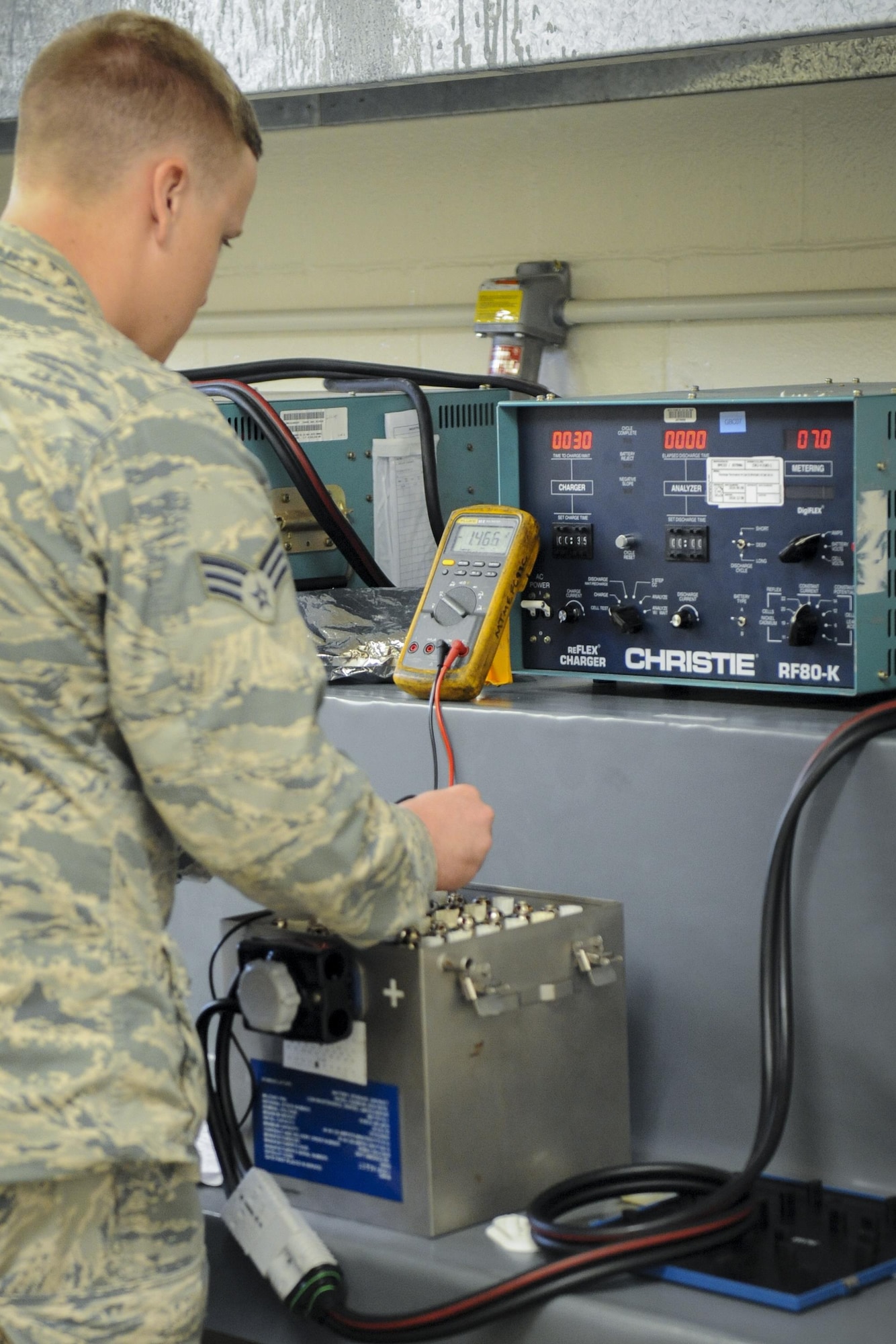 U.S. Air Force Senior Airman Cory Guibert, 23d Component Maintenance Squadron aircraft electrical and environmental journeyman, verifies the voltage of a Nickel-Cadmium battery used in A-10C Thunderbolt IIs, Aug. 8, 2016, at Moody Air Force Base, Ga. E and E maintains and replaces all batteries for Moody’s HC-130J Combat King IIs, HH-60G Pave Hawks and A-10C Thunderbolt IIs. (U.S. Air Force photo by Airman 1st Class Daniel Snider)