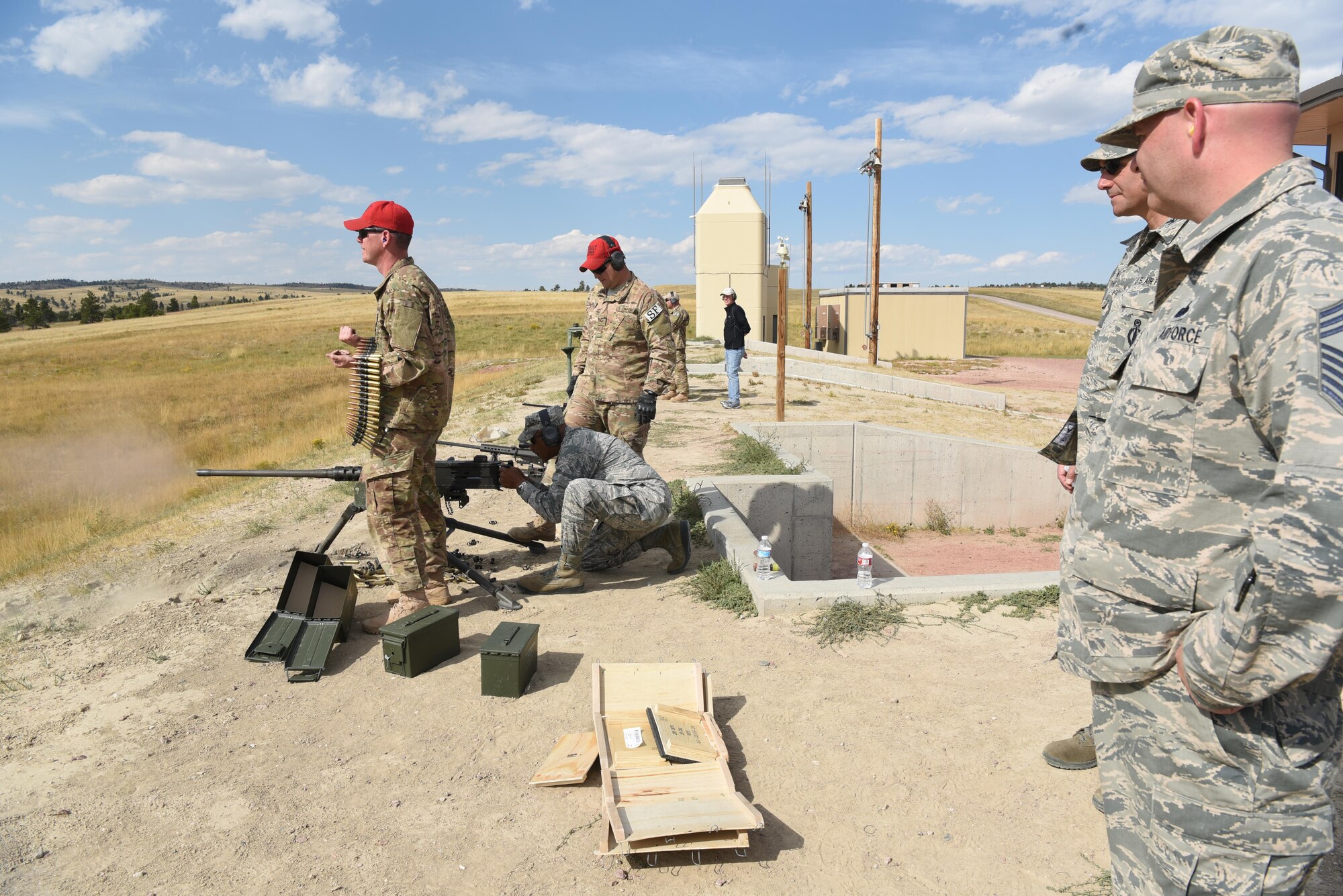 Maj. Gen. Anthony Cotton, 20th Air Force and Task Force 214 commander, fires a .50-caliber M2 heavy-barrel machine gun during the fall 20th AF Senior Leadership Conference at Camp Guernsey, Wyo., Sept. 19, 2016. By testing weapons, 20th AF leaders gained insight into 620th Ground Combat Training Squadron operations. The conference gave 20th AF leadership an opportunity to work together to continually improve mission performance.