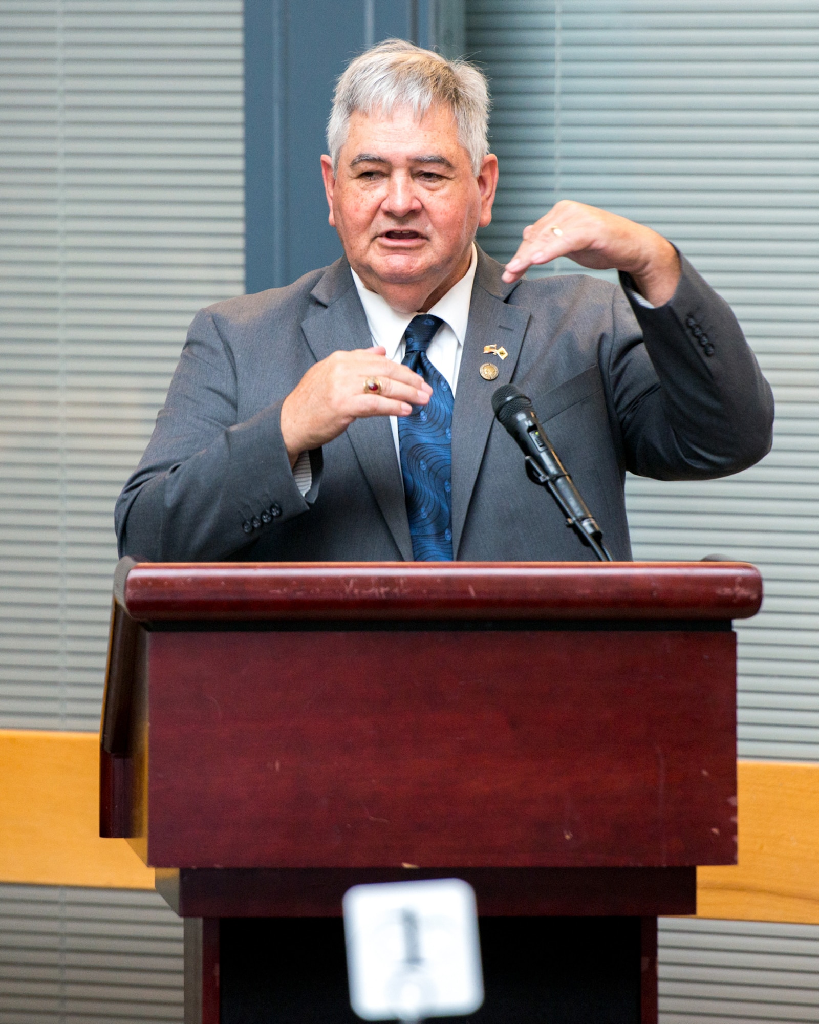 Former Prisoner of War Mike O’Connor provides remarks during the POW/MIA Luncheon at Travis Air Force Base, Calif., Sept. 16, 2016.  O’Connor was held captive for more than five years after his aircraft crashed in South Vietnam in 1968, he was released in 1973 under the Paris Peace Accords. (U.S. Air Force photo by Louis Briscese)