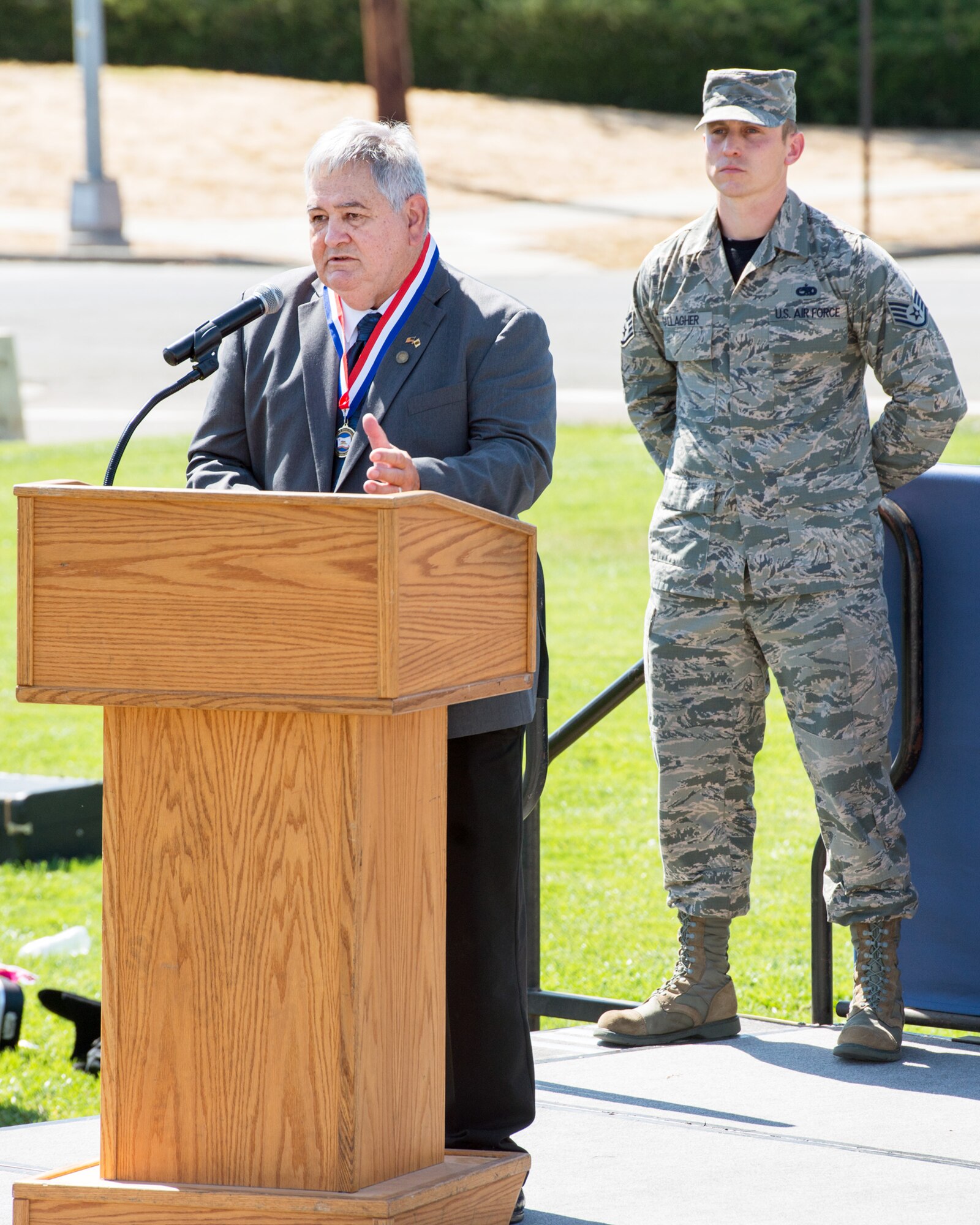Former Prisoner of War Mike O’Connor provides remarks during the POW/MIA Remembrance Ceremony at Travis Air Force Base, Calif., Sept. 16, 2016. The ceremony was held in honor of POW/MIA Recognition Day which honors former prisoners of war and the more than 83,000 American troops missing in action since WW II. (U.S. Air Force photo by Louis Briscese)