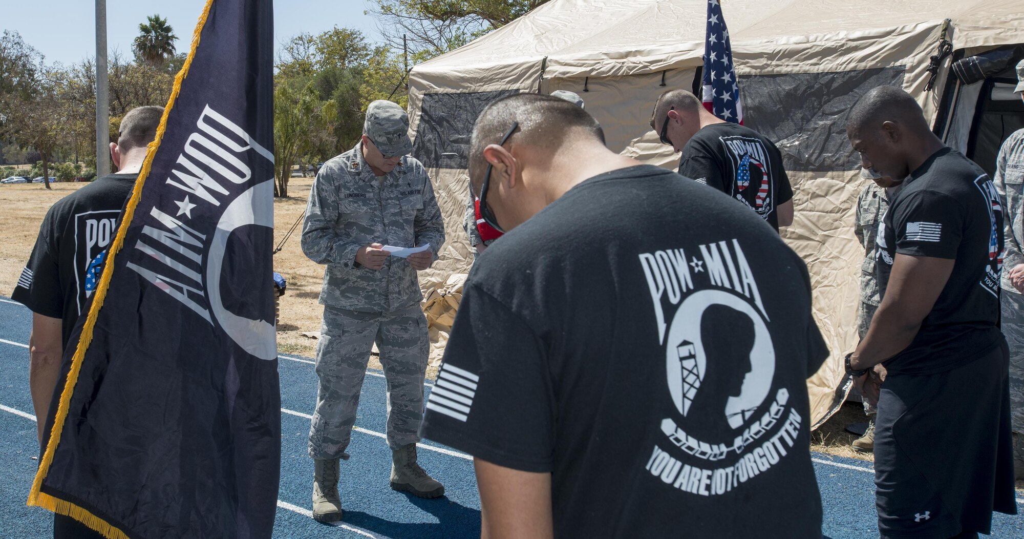 Maj. Glenn Lunberg, 349th Air Mobility Wing chaplain, delivers the invocation prior to the start of a 24-hour-long Prisoner of War/Missing in Action run, Sept. 14, 2016, Travis Air Force Base, Calif. The run honors the nation's former prisoners of war and those service members who are still missing in action. (U.S. Air Force Photo by Heide Couch)