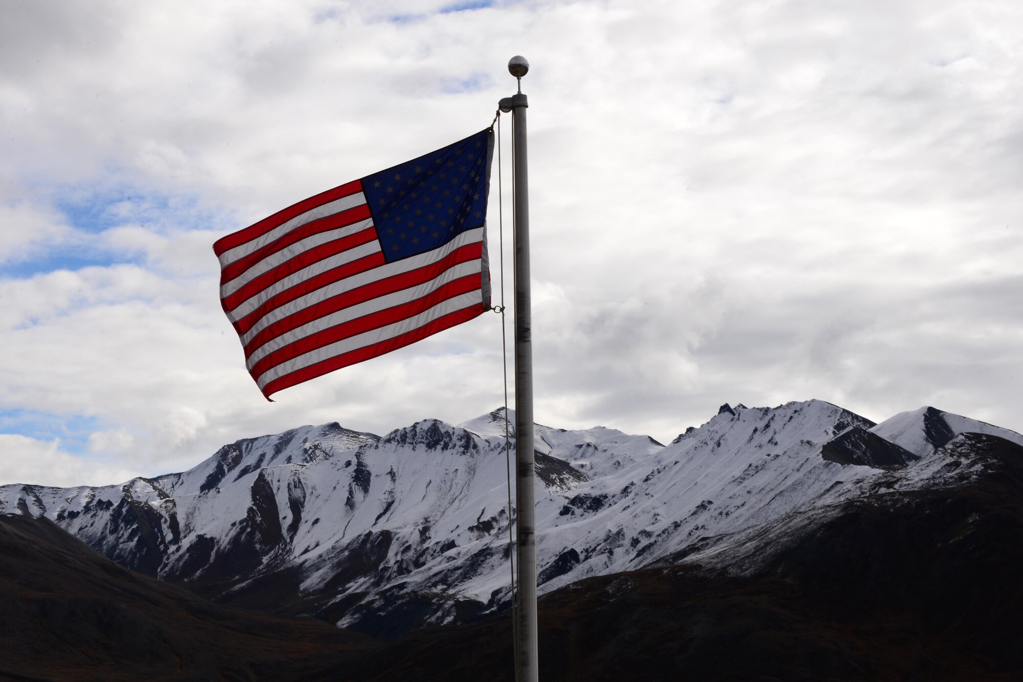 An American Flag waves in the wind at the Eielson Visitor Center in Denali National Park and Preserve, Alaska, Sept. 17, 2016. The Eielson Visitor Center is located at mile 65.9 of the road to Kantishna, and offers views of Denali, hiking trails and sighting of Alaskan wildlife. (U.S. Air Force photo by Airman 1st Class Cassandra Whitman)