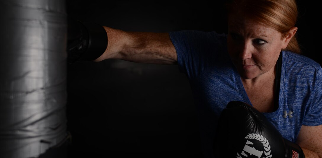 Air Force Staff Sgt. Veronica Montes, a Basic Photojournalist Course-USAF instructor at the Defense Information School, punches a heavy bag Sept. 13, 2016, in the combative rooms of the Gaffney Fitness Center on Fort Meade, Md. Montes studies the Israeli martial art Krav Maga, which focuses on aggressively disabling an attacker so the victim can escape.