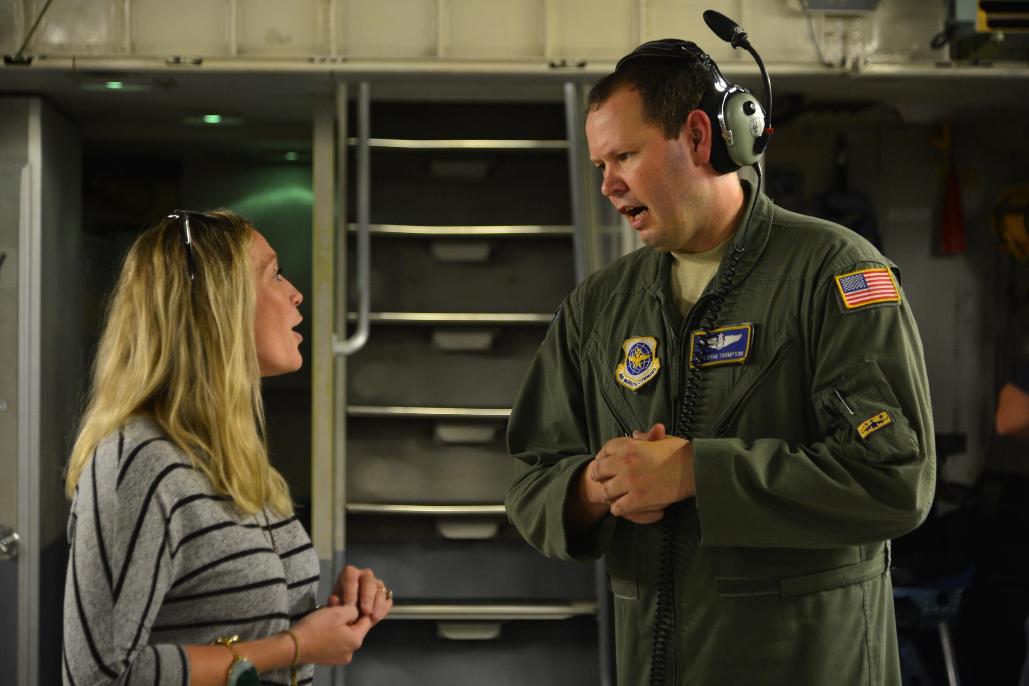 Staff Sgt. Ryan Thompson, 3rd Airlift Squadron loadmaster, answers questions from Stephanie Preece, 373rd Training Squadron Detachment 3 honorary commander, during an incentive flight Sept. 21, 2016, out of Dover Air Force Base, Del. The flight also included mid-air refueling from two KC-135A Stratotankers assigned to the 171st Air Refueling Wing, Pittsburgh International Airport, Pa. (U.S. Air Force photo by Senior Airman William Johnson)