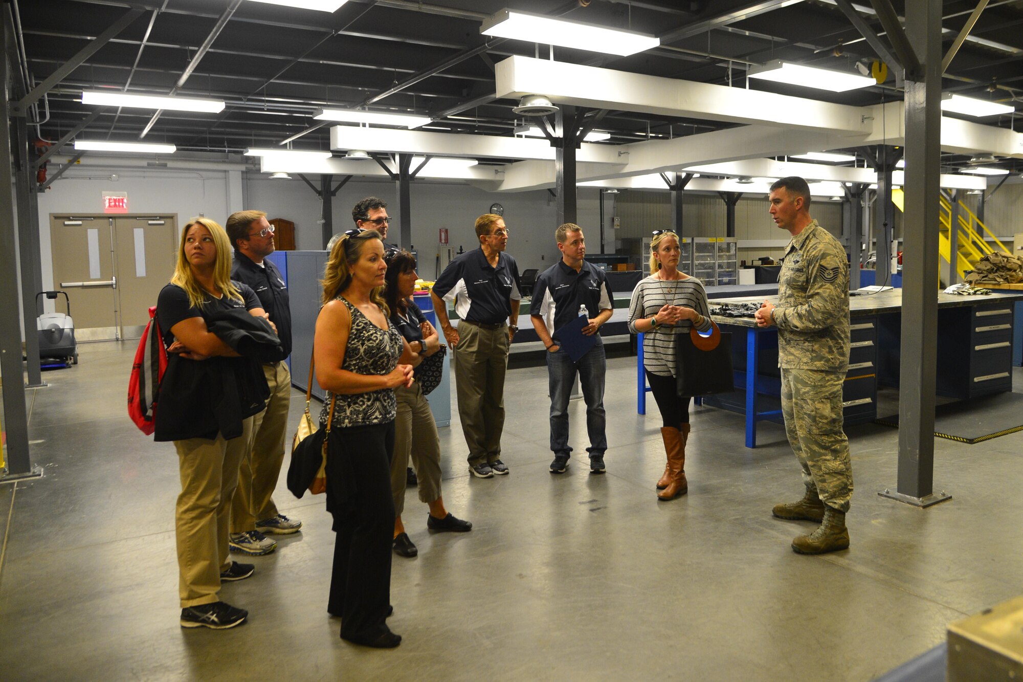 Tech. Sgt. Clay Morris, 436th Operations Support Squadron Aircrew Flight Equipment production supervisor, gives a tour of the AFE facility to honorary commanders Sept. 21, 2016, at Dover Air Force Base, Del. The honorary commanders saw how aircrews depend on AFE for mission success. (U.S. Air Force photo by Senior Airman William Johnson)