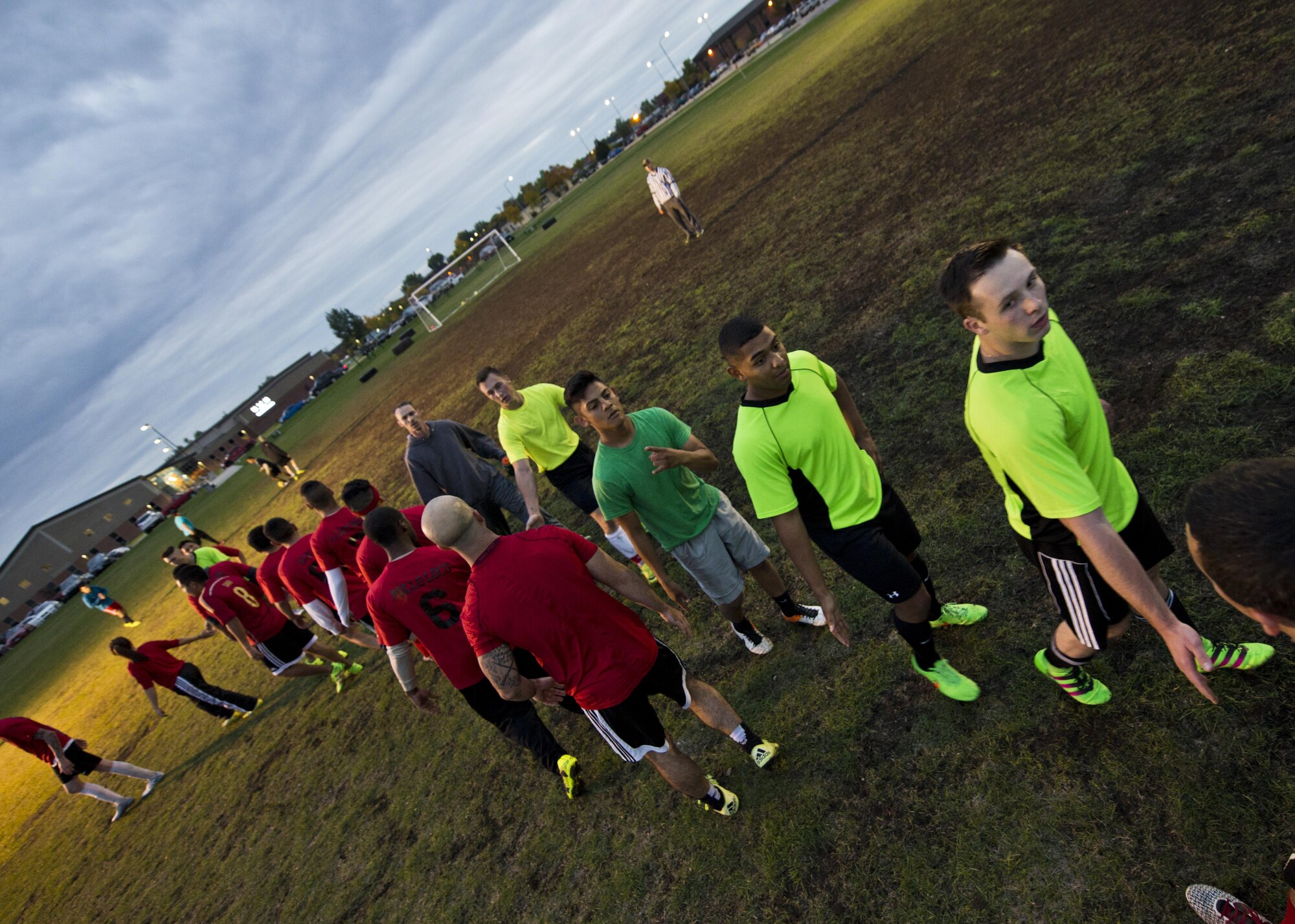 The 5th Security Forces Squadron (yellow) and the 91st Missile Security Forces Squadron (red) shake hands during the first game in the intramural soccer championship tournament at Minot Air Force Base, N.D., Sept. 21, 2016. The 91st MSFS advanced to the next round against the 5th Maintenance Squadron. (U.S. Air Force photo/Airman 1st Class J.T. Armstrong)
