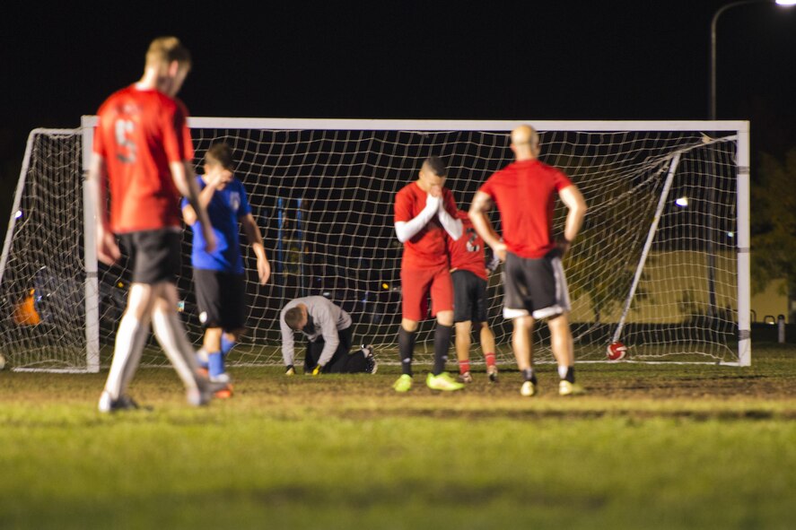 Members of the 91st Missile Security Forces Squadron (red) recover after a goal scored by the 5th Maintenance Squadron during the final game of the intramural soccer championship at Minot Air Force Base, N.D., Sept. 21, 2016. The 91st MSFS earned 2nd place out of the 13 teams that started the season. (U.S. Air Force photo/Airman 1st Class J.T. Armstrong) 