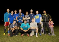Members of the 5th Maintenance Squadron pose for a photo after the final game of the intramural soccer championship at Minot Air Force Base, N.D., Sept. 21, 2016. The 5th MXS was awarded the trophy after beating the 91st Missile Security Forces Squadron in the final game. (U.S. Air Force photo/Airman 1st Class J.T. Armstrong) 