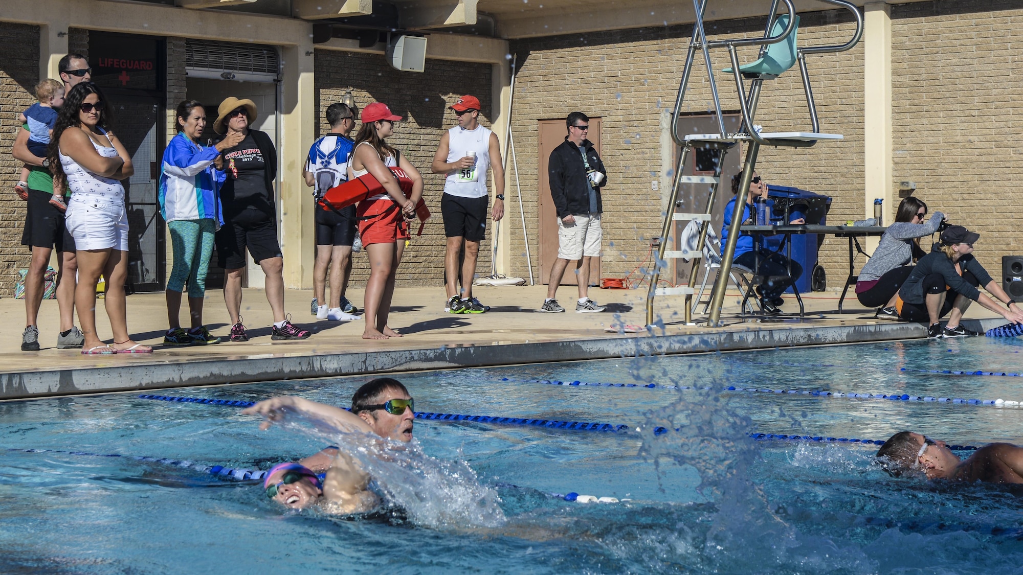 Athletes compete in the 700 meter swimming portion of Holloman’s eighth annual Monster Triathlon at Holloman Air Force Base, N.M. on Sept. 17, 2016. Light refreshments and snacks were provided to race participants by 49th Force Support Squadron event staff. (U.S. Air Force photo by Airman 1st Class Alexis P. Docherty)