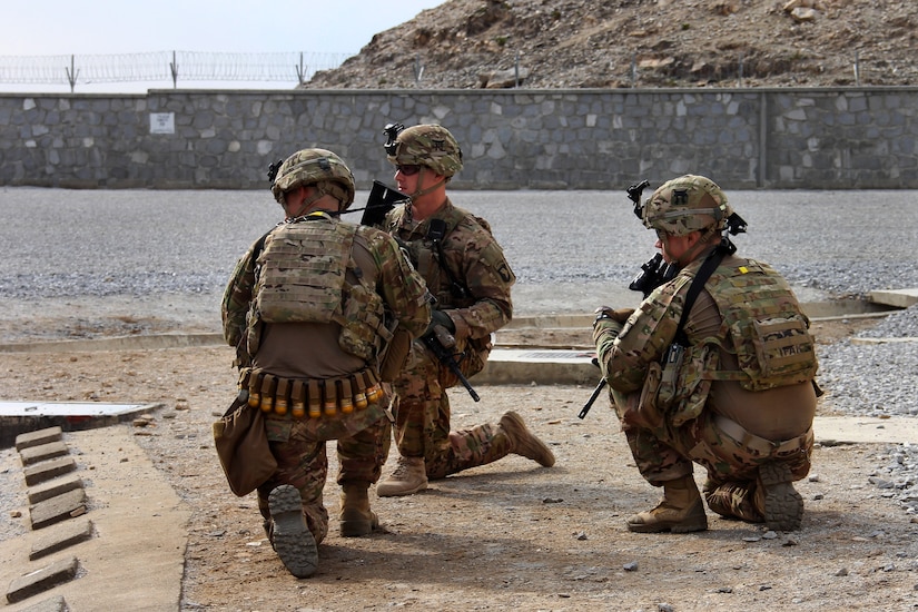 Three soldiers from the 3rd Brigade Combat Team, 101st Airborne Division (Air Assault), assigned to the Train, Advise, Assist Command - East security force, hold their positions and prepare for the landing of a UH-60 Black Hawk helicopter at the conclusion of an advising visit to the Nangarhar police Regional Logistics Center, Afghanistan, Feb. 17, 2015. Army photo by Capt. Jarrod Morris
