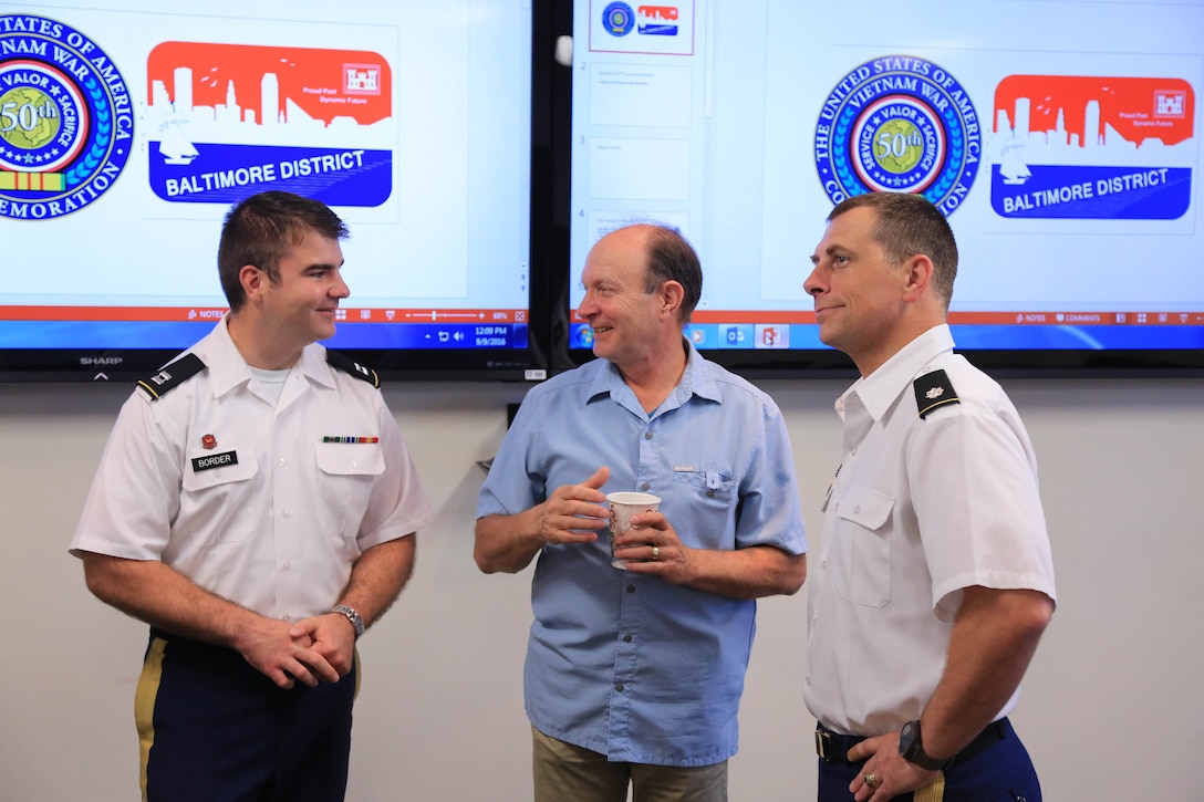 Raymond Klitch, U.A. Army Corps of Engineers, Baltimore District, talks with Capt. Patrick Border (left) and Lt. Col. Michael Ruppert during the veterans gathering.