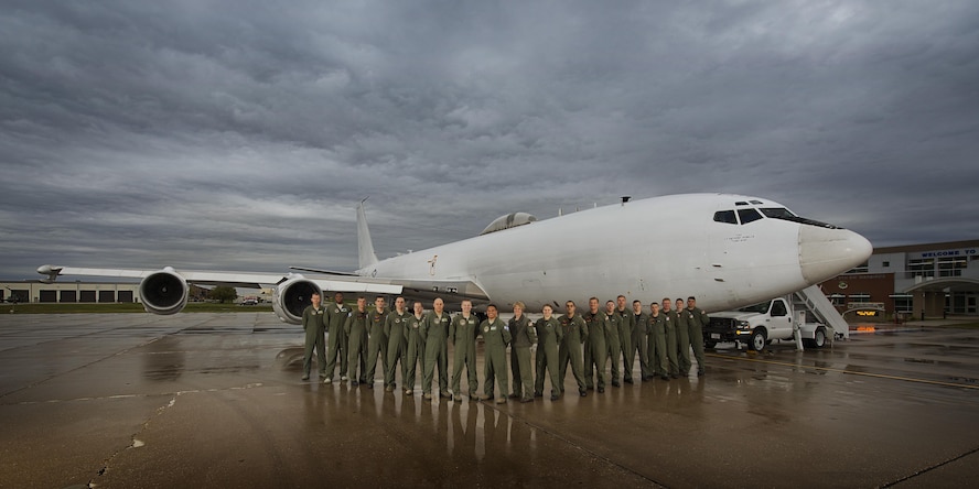 Members of U.S. Strategic Command stand in front of their U.S. Navy E6-B Mercury at Minot Air Force Base, N.D., Sept 19, 2016. The crew operates as the Airborne Command Post, having the ability to command and control U.S. STRATCOM’s Intercontinental Ballistic Missiles. (U.S. Air Force photo/Airman 1st Class J.T. Armstrong)