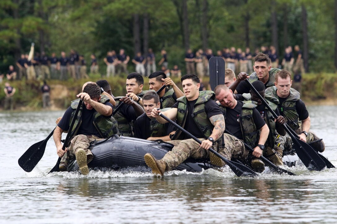 Paratroopers compete in the Waal River Crossing Competition at Fort Bragg, N.C., Sept. 22, 2016. The event marks the 72nd anniversary of when engineers assisted the 504th Parachute Infantry Regiment across the Waal River under enemy fire. Soldiers used only helmets and rifles as paddles in canvass boats. Army photo by Sgt. Anthony Hewitt