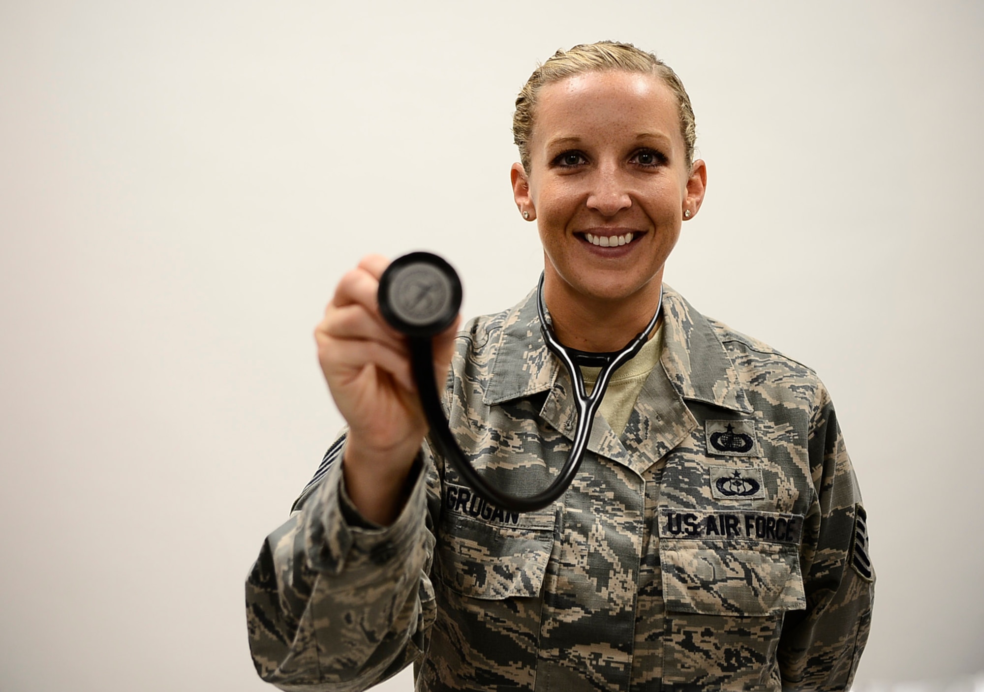Tech. Sgt. Jessica Grogan, contracting officer and team lead with the 6th Contracting Squadron, pauses for a photo at MacDill Air Force Base, Fla., Sept. 22, 2016. Grogan was notified April 8, 2016 that she was accepted into the Interservice Physician Assistant Program through the Air Force. (U.S. Air Force photo by Senior Airman Tori Schultz)