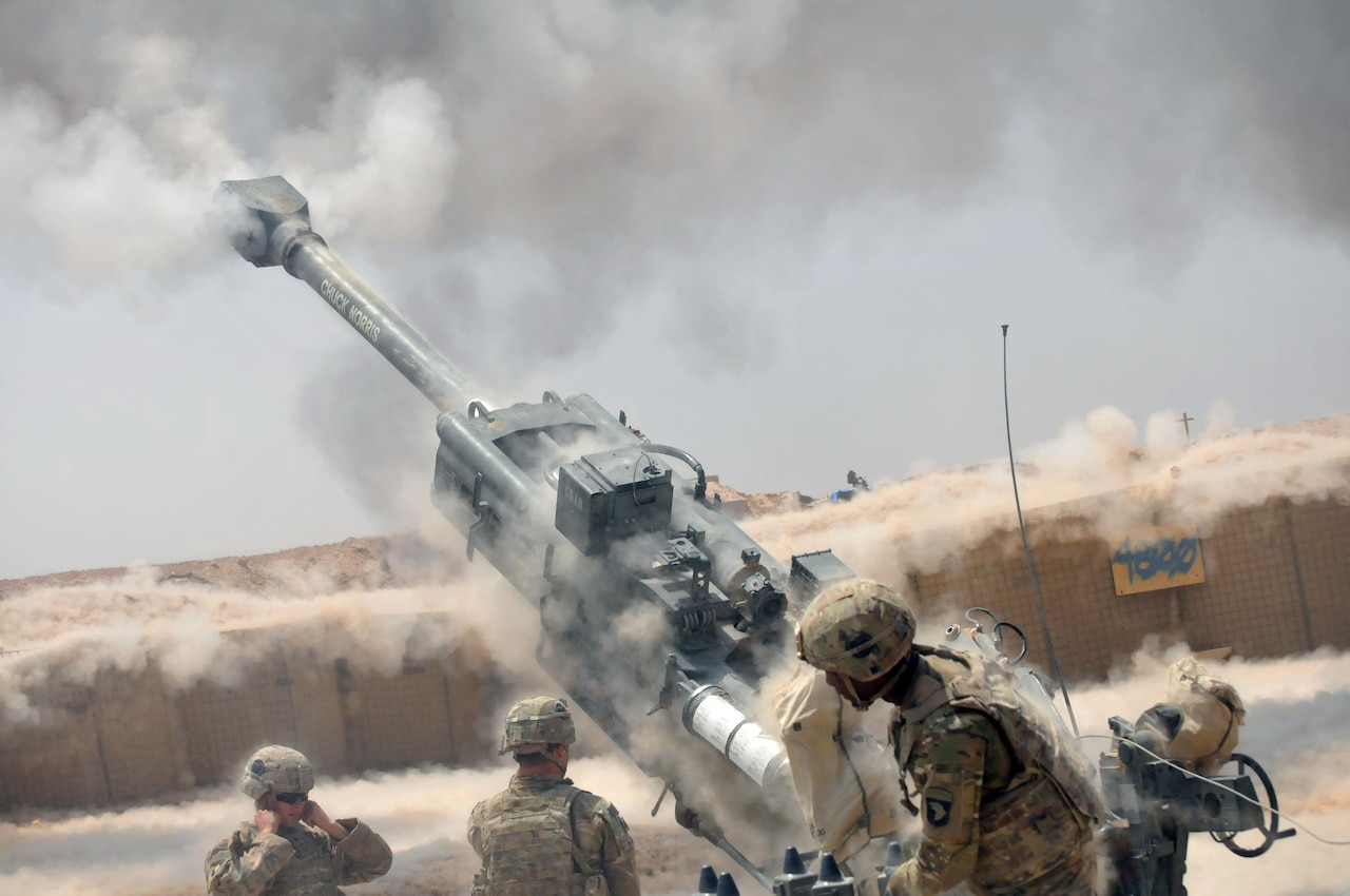 Soldiers with Battery C, 1st Battalion, 320th Field Artillery Regiment, Task Force Strike, execute a fire mission with an M777 howitzer during an operation to support Iraqi security forces at Kara Soar Base, Iraq, Aug. 7, 2016. Army photo by 1st Lt. Daniel I Johnson