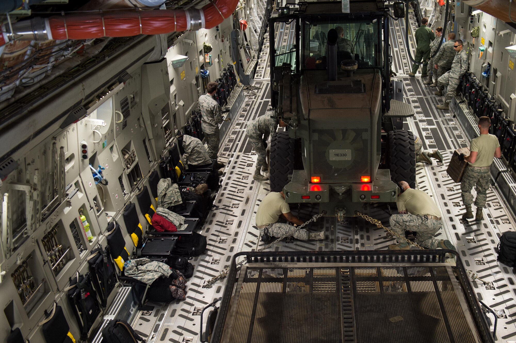 U.S. Airmen assigned to the 821st Contingency Response Group load a 10K forklift onto a C-17 Globemaster III aircraft during Exercise Cerberus Strike 16-02 at Gunnison-Crested Butte Regional Airport, Colo., Sept. 09, 2016. C-Strike is a joint exercise where contingency response forces rehearsed potential real-world situations by training with Army counterparts in cargo uploading and downloading on aircraft, aircraft engine running off-loads, communications, aerial port procedures, and air mobility liaison officer operations with airdrops from aircraft. (U.S. Air Force photo by Master Sgt. Joseph Swafford)