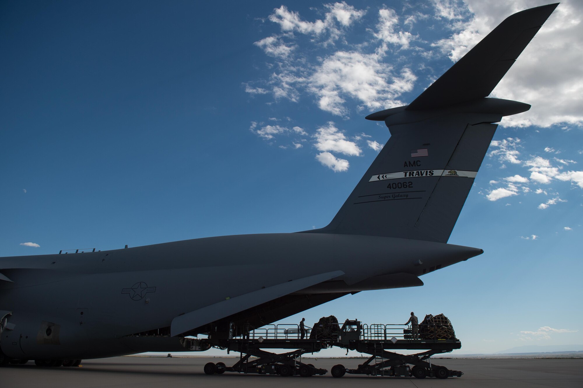 U.S. Airmen assigned to the 821st Contingency Response Group offload cargo from a C-5 Galaxy aircraft during Exercise Cerberus Strike 16-02 at the Fort Carson Air Terminal, Colo., Sept. 09, 2016. C-Strike is a joint exercise where contingency response forces rehearsed potential real-world situations by training with Army counterparts in cargo uploading and downloading on aircraft, aircraft engine running off-loads, communications, aerial port procedures, and air mobility liaison officer operations with airdrops from aircraft. (U.S. Air Force photo by Master Sgt. Joseph Swafford)