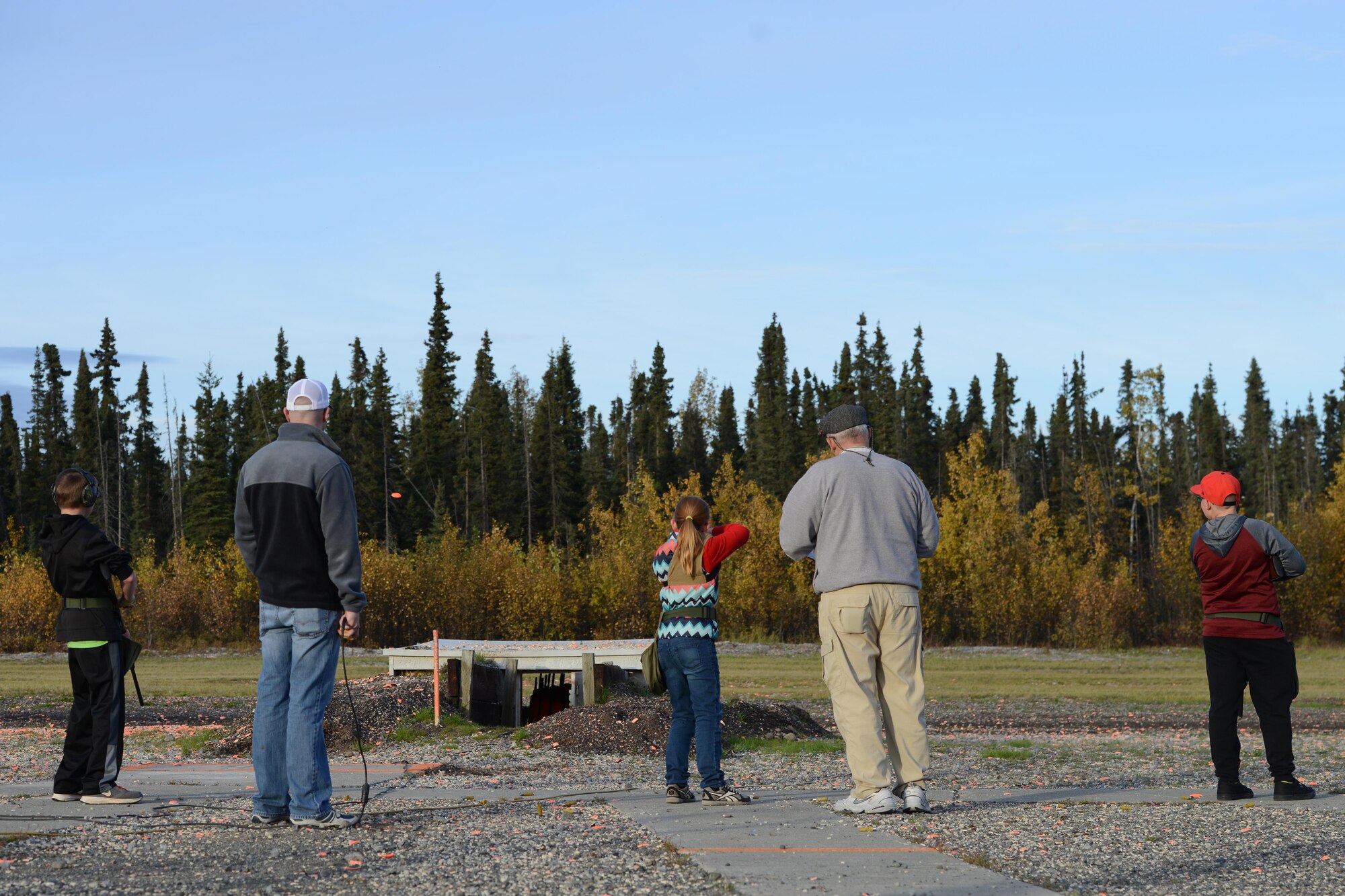 Hannah Funches, 12, fires her shotgun at the Joint Base Elmendorf-Richardson Trap and Skeet Range, Sept. 19, 2016. The JBER Clay Bears, the JBER Youth Shotgun League, is a joint venture between 673d Force Support Squadron and the Alaska Department of Fish and Game. 