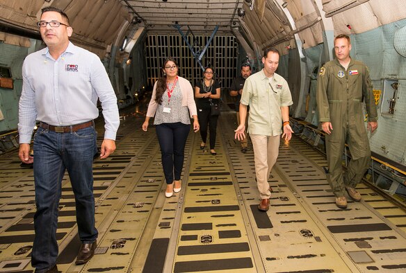 Members with the San Antonio Food Bank tour the cargo hold of a C-5A Galaxy aircraft Sept. 22, 2016 at Joint Base San Antonio-Lackland, Texas. The tour consisted of a mission brief given by Col. Thomas Smith, 433rd Airlift Wing commander, and a walk through tour of a C-5A Galaxy aircraft.  (U.S. Air Force photo by Benjamin Faske) 