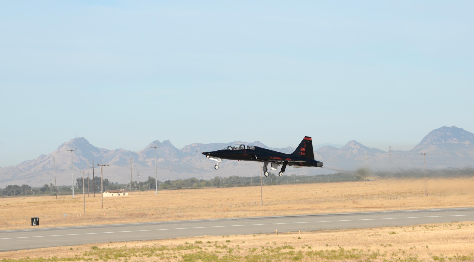 A T-38 Talon takes off Sept. 23, 2016, at Beale Air Force Base. The T-38 flew in a formation to honor the pilot who died during a U-2 Dragon Lady incident that took place near the Sutter Buttes Sept. 20, 2016. Today's flights signified the U-2 returning to normal flying operations locally. (U.S. Air Force photo/Airman Tristan D. Viglianco)