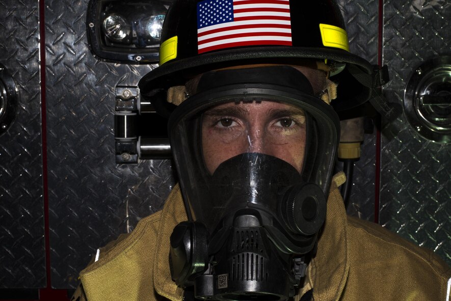 Airman 1st Class Travis Dyer suits up during a training session at Maxwell Air Force Base, 23 September. His team will compete in the Scott Safety Firefighter Combat Challenge in Montgomery, 24-29 October. (U.S. Air Force photo by Senior Airman Wililam Blankenship)