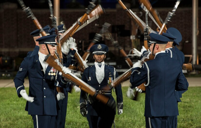 The U.S. Air Force Honor Guard Drill Team performs a rifle demonstration during the 2016 U.S. Air Force Tattoo at Joint Base Anacostia-Bolling, Washington, D.C., Sept. 22, 2016. In addition to the team’s performance, the event consisted of U.S. Air Force Band routines, aircraft flyovers, and heritage speeches.