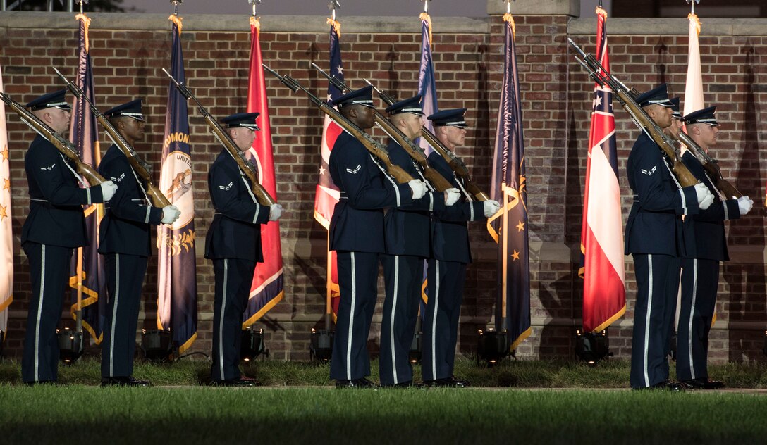The U.S. Air Force Honor Guard Drill Team lines up in front of world flags during the 2016 U.S. Air Force Tattoo at Joint Base Anacostia-Bolling, Washington, D.C., Sept. 22. In addition to the team’s performance, the event consisted of U.S. Air Force Band routines, aircraft flyovers and heritage speeches.