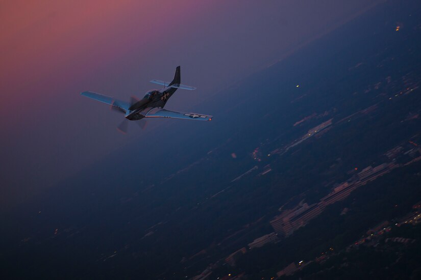 A P-51 Mustang flies over the National Capital Region are during a "Warbirds" tribute flight Sept. 21, 2016. The flight was part of the dress rehearsal for the 2016 Air Force Tattoo held at Joint Base Anacostia-Bolling, Washington, D.C., Sept. 22, 2016. The formation also included a B-25 Mitchell. (U.S. Air Force photo by Airman 1st Class Rustie Kramer)