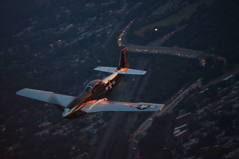 A P-51 Mustang flies over the Potomac River during a "Warbirds" practice flight for the dress rehearsal of the 2016 Air Force Tattoo, Sept. 21, 2016. The military tattoo was held at Joint Base Anacostia-Bolling, Washington, D.C., Sept. 22, 2016 to commemorate the Air Force's 69th birthday. The formation also include a B-25 Mitchell. (U.S. Air Force photo by Airman 1st Class Rustie Kramer)