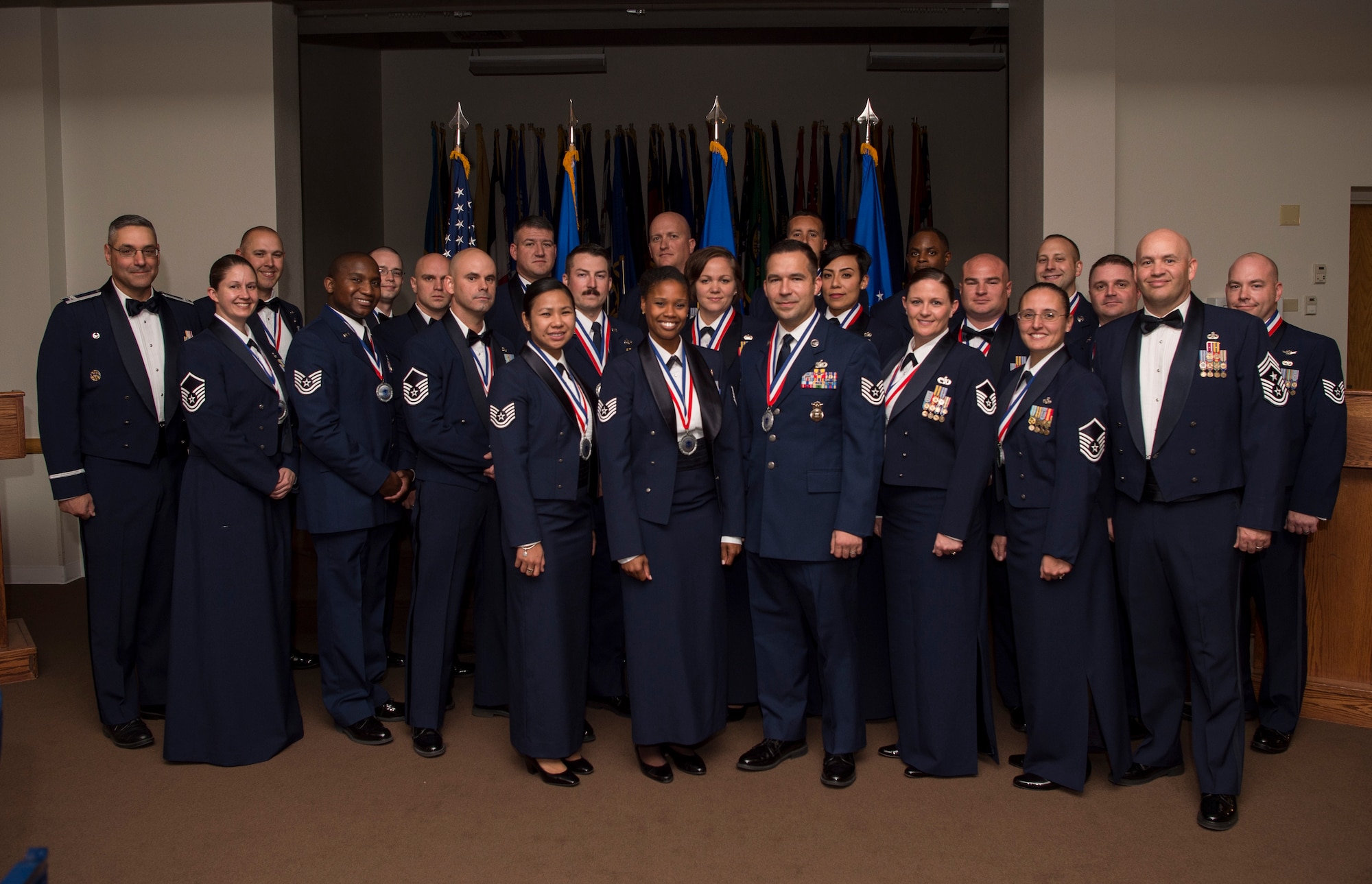Senior NCO inductees pose for a group photo during a senior NCO induction ceremony at F.E. Warren Air Force Base, Wyo., Sept. 23, 2016. The induction ceremony recognized enlisted Airmen from the base who earned their promotion into the senior NCO tier. (U.S. Air Force photo by Staff Sgt. Christopher Ruano)