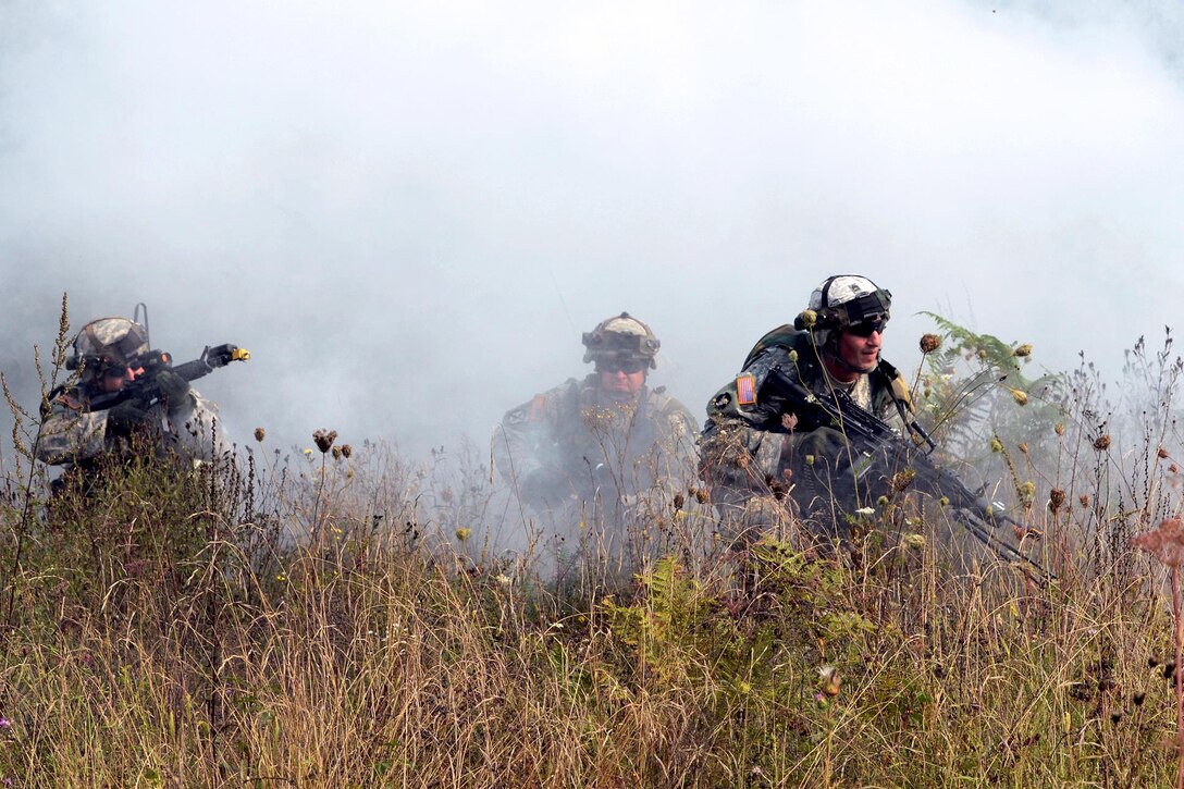 U.S. soldiers conduct an attack drill through smoke as part of exercise Immediate Response 16 at the armed forces training area in Slunj, Croatia, Sept. 14, 2016. The soldiers are assigned to the Minnesota Army National Guard’s 2nd Battalion, 135th Infantry Brigade. The brigade-level exercise uses computer-assisted simulations and field training in Croatia and Slovenia. Army photo by Staff Sgt. Opal Vaughn