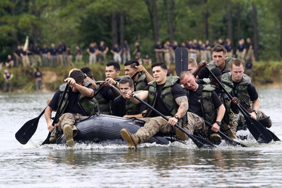 Paratroopers compete in the Waal River Crossing Competition at Fort Bragg, N.C., Sept. 22, 2016. The event marks the 72nd anniversary of when engineers assisted the 504th Parachute Infantry Regiment across the Waal River under enemy fire. Soldiers used only helmets and rifles as paddles in canvass boats. Army photo by Sgt. Anthony Hewitt