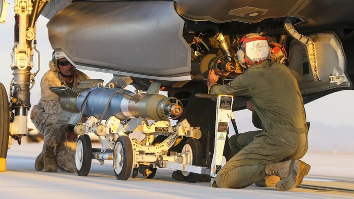 U.S. Marines with Marine Fighter Attack Squadron 121, 3rd Marine Aircraft Wing, conduct the first ever hot load on the F-35B Lightning II in support of Weapons and Tactics Instructor Course 1-17 at Marine Corps Air Station Yuma, Ariz., Sept. 22, 2016. The exercise is part of WTI 1-17, a seven-week training event hosted by Marine Aviation Weapons and Tactics Squadron One cadre. MAWTS-1 provides standardized tactical training and certification of unit instructor qualifications to support Marine Aviation Training and Readiness and assists in developing and employing aviation weapons and tactics.