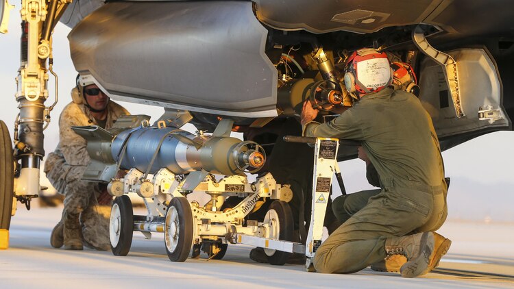 U.S. Marines with Marine Fighter Attack Squadron 121, 3rd Marine Aircraft Wing, conduct the first ever hot load on the F-35B Lightning II in support of Weapons and Tactics Instructor Course 1-17 at Marine Corps Air Station Yuma, Ariz., Sept. 22, 2016. The exercise is part of WTI 1-17, a seven-week training event hosted by Marine Aviation Weapons and Tactics Squadron One cadre. MAWTS-1 provides standardized tactical training and certification of unit instructor qualifications to support Marine Aviation Training and Readiness and assists in developing and employing aviation weapons and tactics.
