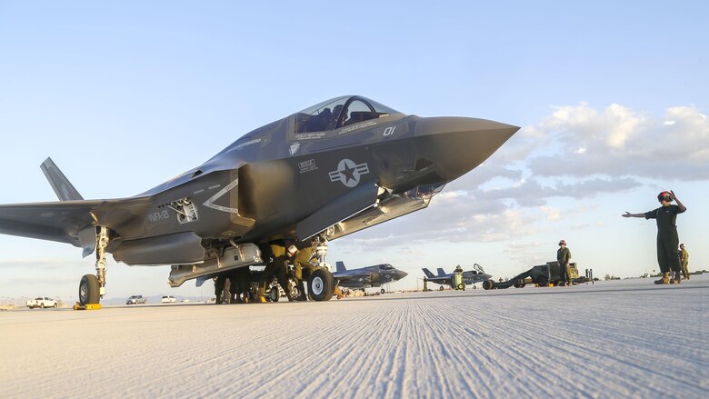 U.S. Marines with Marine Fighter Attack Squadron 121, 3rd Marine Aircraft Wing, conduct the first ever hot load on the F-35B Lightning II in support of Weapons and Tactics Instructor Course 1-17 at Marine Corps Air Station Yuma, Ariz., Sept. 22, 2016. The exercise is part of WTI 1-17, a seven-week training event hosted by Marine Aviation Weapons and Tactics Squadron One cadre. MAWTS-1 provides standardized tactical training and certification of unit instructor qualifications to support Marine Aviation Training and Readiness and assists in developing and employing aviation weapons and tactics.