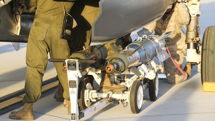 U.S. Marines with Marine Fighter Attack Squadron 121, 3rd Marine Aircraft Wing, conduct the first ever hot load on the F-35B Lightning II in support of Weapons and Tactics Instructor Course 1-17 at Marine Corps Air Station Yuma, Ariz., Sept. 22, 2016. The exercise is part of WTI 1-17, a seven-week training event hosted by Marine Aviation Weapons and Tactics Squadron One cadre. MAWTS-1 provides standardized tactical training and certification of unit instructor qualifications to support Marine Aviation Training and Readiness and assists in developing and employing aviation weapons and tactics.