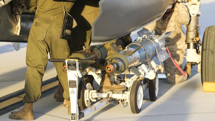 U.S. Marines with Marine Fighter Attack Squadron 121, 3rd Marine Aircraft Wing, conduct the first ever hot load on the F-35B Lightning II in support of Weapons and Tactics Instructor Course 1-17 at Marine Corps Air Station Yuma, Ariz., Sept. 22, 2016. The exercise is part of WTI 1-17, a seven-week training event hosted by Marine Aviation Weapons and Tactics Squadron One cadre. MAWTS-1 provides standardized tactical training and certification of unit instructor qualifications to support Marine Aviation Training and Readiness and assists in developing and employing aviation weapons and tactics.
