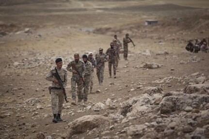 Soldiers from the Nineveh Plain Protection Unit patrol a mountainside during a react to contact training exercise at their training facility in the Nineveh Province, May 18, 2016.  The NPPU are a small group of fighters who came together to protect their people in the fight against the Islamic State of Iraq and the Levant.  Training focused on the Combined Joint Task Force – Operation Inherent Resolve overall mission to build partner capacity and increase the military capacity of local forces fighting ISIL.  (U.S. Army photo by Staff Sgt. Sergio Rangel)