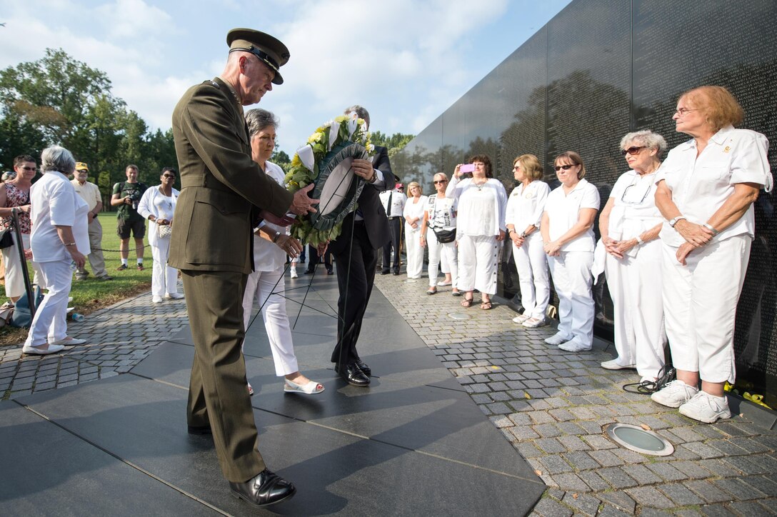 From foreground left, Marine Corps Gen. Joe Dunford, chairman of the Joint Chiefs of Staff; Candy Martin, national president of American Gold Star Mothers Inc.; and Jim Knotts, president and CEO of the Vietnam Veterans Memorial Fund, place a wreath at the Vietnam Veterans Memorial in Washington, D.C., Sept. 24, 2016. American Gold Star Mothers is an organization of mothers who have lost a child in the U.S. military. DoD photo by Army Sgt. James K. McCann