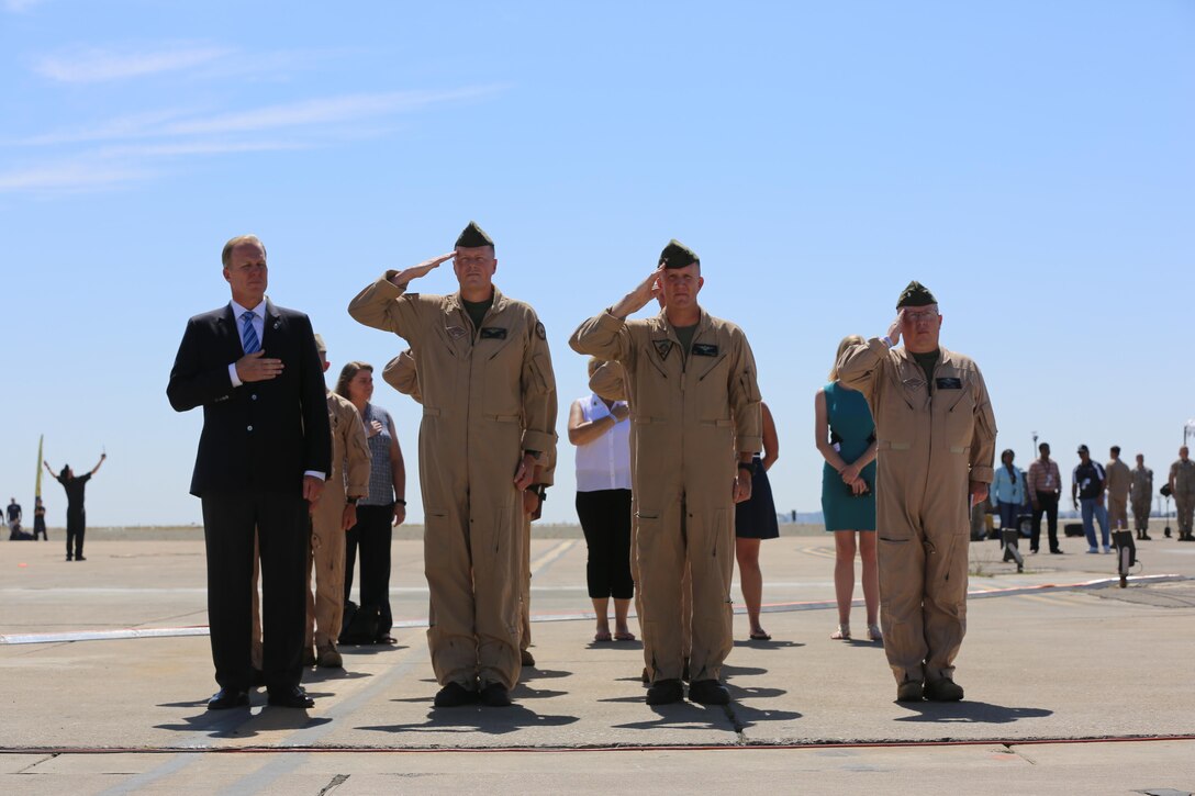 San Diego and Marine Corps Air Station Miramar officials salute during the national anthem at the 2016 MCAS Miramar Air Show opening ceremony aboard MCAS Miramar, Calif., Sept. 23. This year’s theme for the event is “100 Years of the Marine Corps Reserves.” The MCAS Miramar Air Show showcases world-class performers, military flight demonstration teams, the capabilities of the Marine Air-Ground Task Force and celebrates Miramar’s longstanding relationship with the local San Diego community. (U.S. Marine Corps photo by Cpl. Kimberlyn Adams/Released)