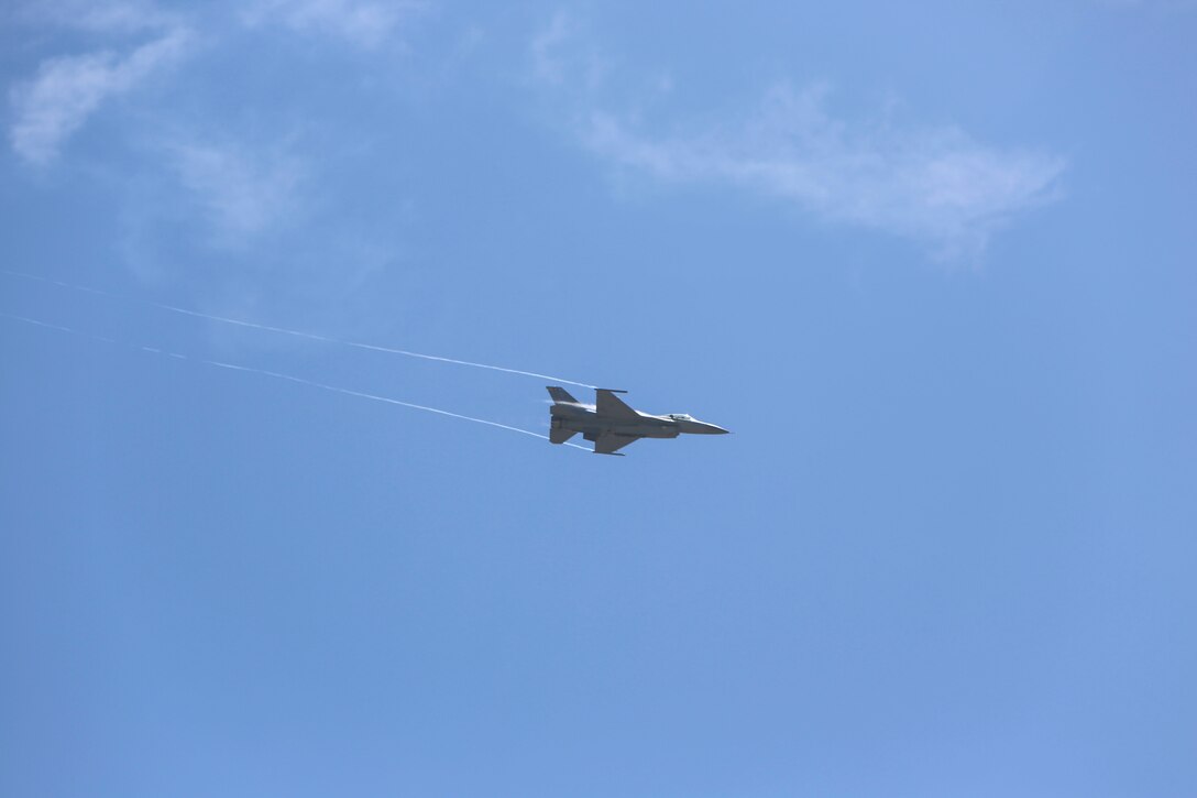 A U.S. Air Force F-16 Viper performs a tactical demonstration and heritage flight during the 2016 MCAS Miramar Air Show aboard Marine Corps Air Station Miramar, Calif., Sept. 23. The heritage flight presents the evolution of the Air Force by flying the current state-of-the-art fighter aircraft in formation with vintage aircraft. The MCAS Miramar Air Show showcases world-class performers, military flight demonstration teams, the capabilities of the Marine Air-Ground Task Force and celebrates Miramar’s longstanding relationship with the local San Diego community. (U.S. Marine Corps photo by Lance Cpl. Harley Robinson/Released)