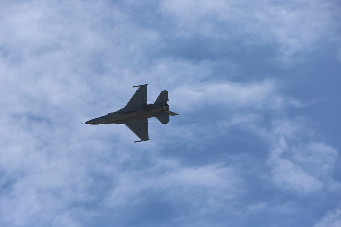 A U.S. Air Force F-16 Viper performs a tactical demonstration and heritage flight during the 2016 MCAS Miramar Air Show aboard Marine Corps Air Station Miramar, Calif., Sept. 23. The heritage flight presents the evolution of the Air Force by flying the current state-of-the-art fighter aircraft in formation with vintage aircraft. The MCAS Miramar Air Show showcases world-class performers, military flight demonstration teams, the capabilities of the Marine Air-Ground Task Force and celebrates Miramar’s longstanding relationship with the local San Diego community. (U.S. Marine Corps photo by Lance Cpl. Harley Robinson/Released)