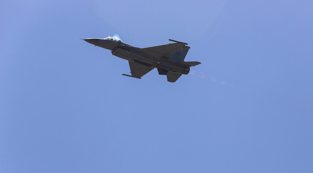 A U.S. Air Force F-16 Viper performs a tactical demonstration and heritage flight during the 2016 MCAS Miramar Air Show aboard Marine Corps Air Station Miramar, Calif., Sept. 23. The heritage flight presents the evolution of the Air Force by flying the current state-of-the-art fighter aircraft in formation with vintage aircraft. The MCAS Miramar Air Show showcases world-class performers, military flight demonstration teams, the capabilities of the Marine Air-Ground Task Force and celebrates Miramar’s longstanding relationship with the local San Diego community. (U.S. Marine Corps photo by Lance Cpl. Harley Robinson/Released)