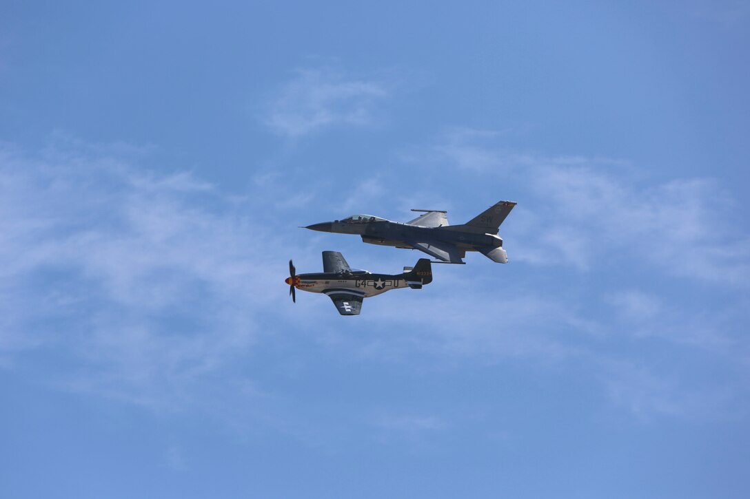A U.S. Air Force F-16 Viper performs a tactical demonstration and heritage flight during the 2016 MCAS Miramar Air Show aboard Marine Corps Air Station Miramar, Calif., Sept. 23. The heritage flight presents the evolution of the Air Force by flying the current state-of-the-art fighter aircraft in formation with vintage aircraft. The MCAS Miramar Air Show showcases world-class performers, military flight demonstration teams, the capabilities of the Marine Air-Ground Task Force and celebrates Miramar’s longstanding relationship with the local San Diego community. (U.S. Marine Corps photo by Lance Cpl. Harley Robinson/Released)