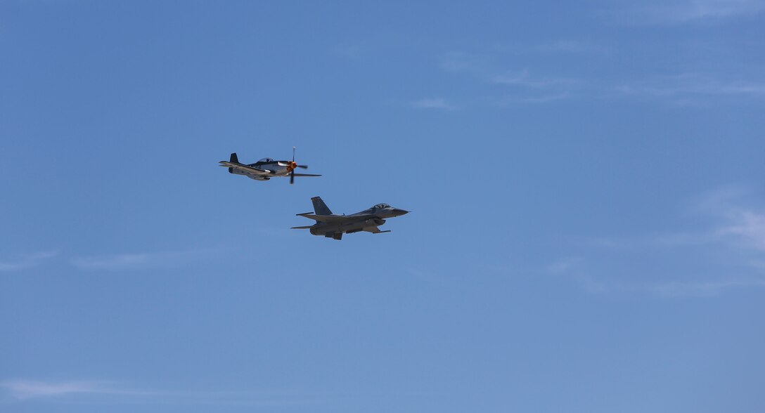 A U.S. Air Force F-16 Viper performs a tactical demonstration and heritage flight during the 2016 MCAS Miramar Air Show aboard Marine Corps Air Station Miramar, Calif., Sept. 23. The heritage flight presents the evolution of the Air Force by flying the current state-of-the-art fighter aircraft in formation with vintage aircraft. The MCAS Miramar Air Show showcases world-class performers, military flight demonstration teams, the capabilities of the Marine Air-Ground Task Force and celebrates Miramar’s longstanding relationship with the local San Diego community. (U.S. Marine Corps photo by Lance Cpl. Harley Robinson/Released)